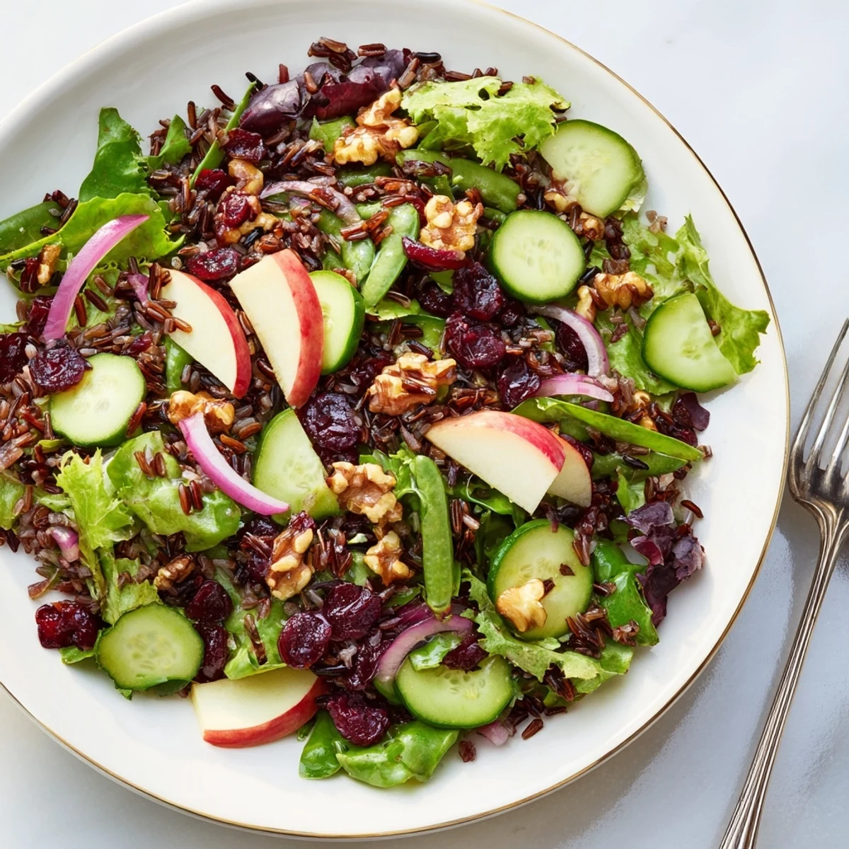 Delicious wild rice and cranberry salad, full of vibrant colors and fresh flavors, ready to enjoy.