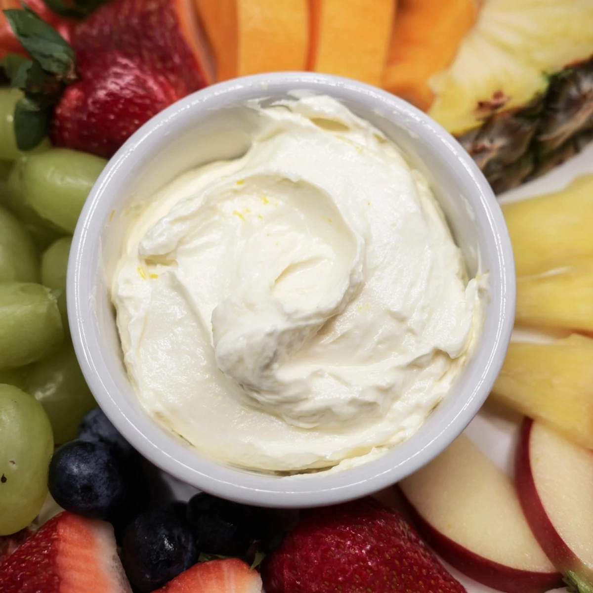A close-up of a delightful cream cheese fruit dip, ready to be enjoyed with tasty fruit.