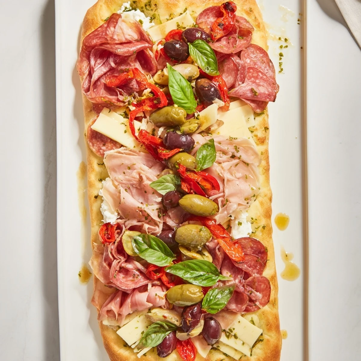 The Rustic Raft appetizer, a vibrant platter of meats, cheeses, and colorful garnishes ready to serve.