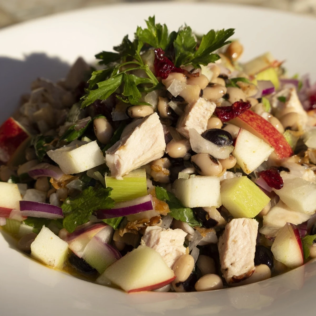 Chicken and Apple New Years Luck Salad, a colorful mix with crisp apples and a tangy dressing.