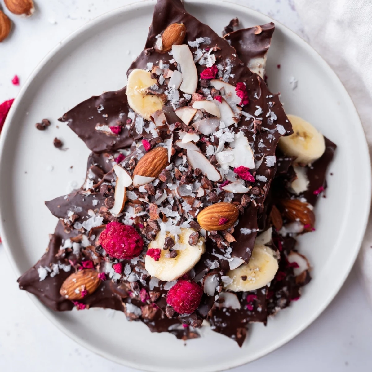 Close-up of Chocolate Banana Bark shows a delicious, sweet dessert loaded with freeze-dried berries.