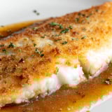 Flounder meunière fillets with crispy edges, drizzled with nutty brown butter sauce and fresh lemon juice.