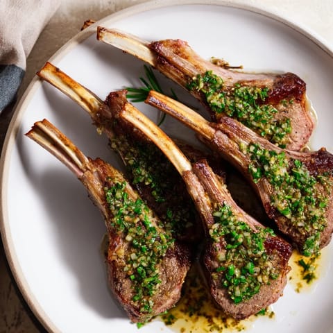 Golden-brown, seared Rustic Mint Weeknight Pan-Seared Lamb Chops, ready to be enjoyed with flavorful homemade mint sauce.