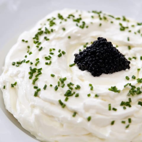 This stunning Diamond Inlay appetizer with caviar displays a visually appealing contrast of textures and flavors.