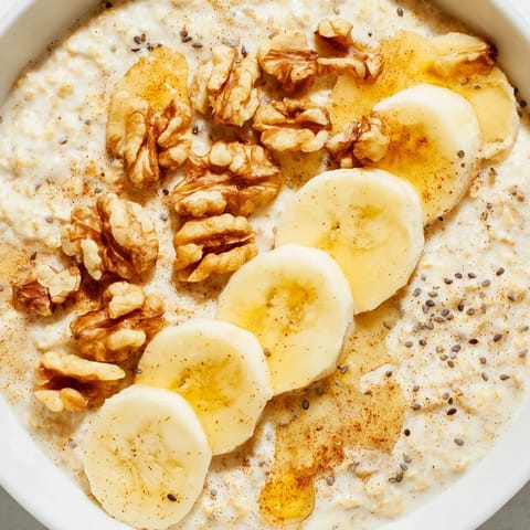 A close-up view of a comforting bowl of sweet and easy Microwave Banana Oats, perfect morning fuel.