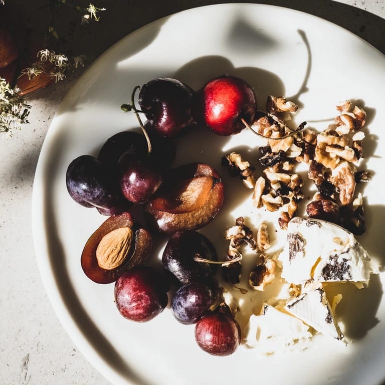 Elegantly arranged, The Midnight Orchard combines fruit, cheese, and optional honey and walnuts.