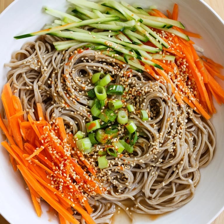 Vivid image of ready-to-eat Chilled Noodle Lunch Cups showcasing fresh cucumber and carrots.