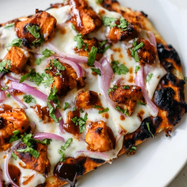 Sliced BBQ Chicken Flatbread served on a platter, perfect for a quick dinner.