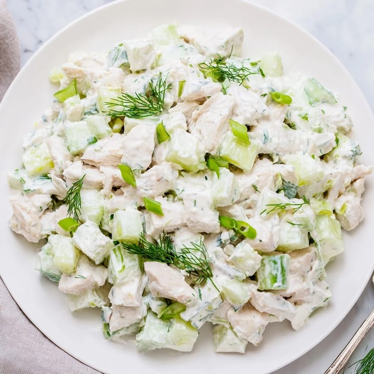 Tender chicken and crisp cucumbers tossed in a refreshing Greek yogurt dressing, perfect for a gluten-free summer meal.